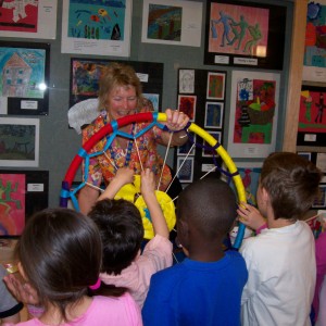 YAC affiliate artist Sarah Haskell leads a weaving project with youth at Nayaug School. Photo by Aleta Staton.