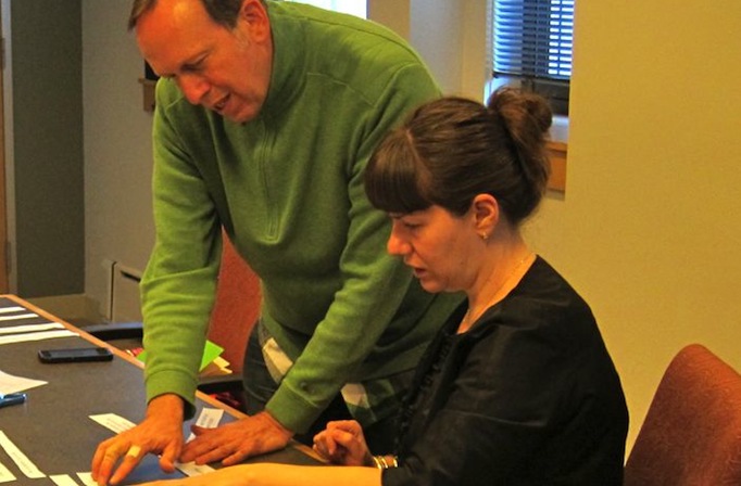 TTO’s Executive Artistic Director and Pride Youth Theatre Alliance (PYTA)’s Co-Chair going through data from a survey sent out to PYTA members.
