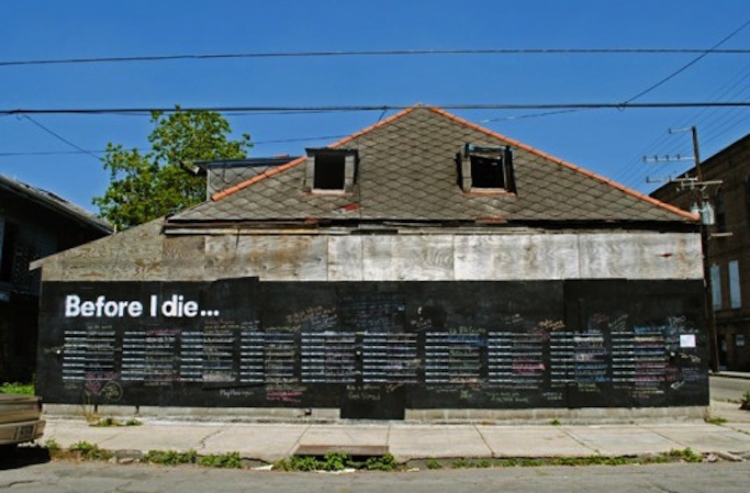 Candy Chang's public art piece, "Before I Die," installed in a New Orleans neighborhood.