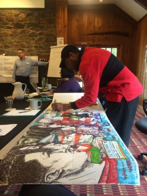 Ariston Jacks, an Alternate ROOTS Member, sketching during ROOTS Innovation Team meetings.